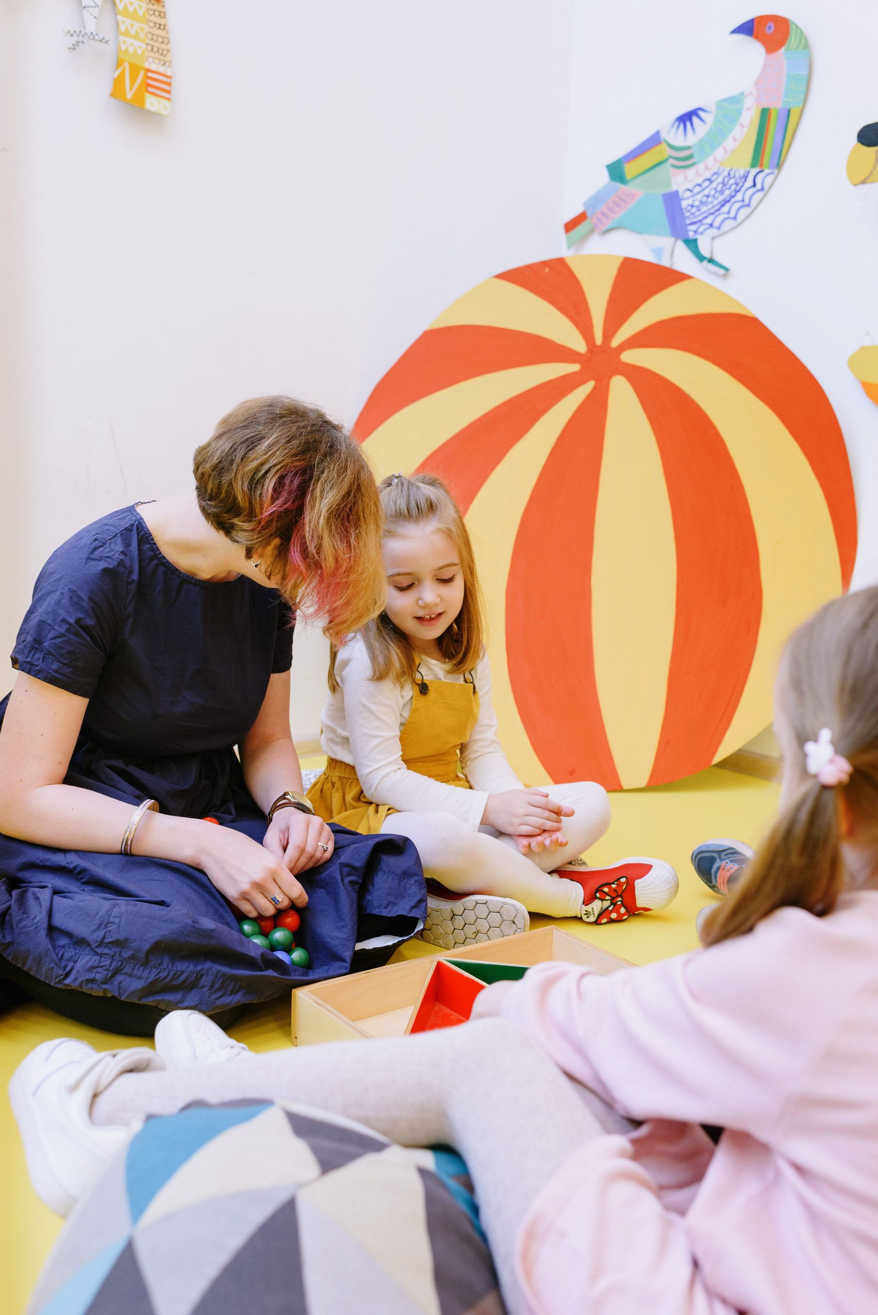 Kids engaging with toys in a vibrant kindergarten, fostering learning and play.